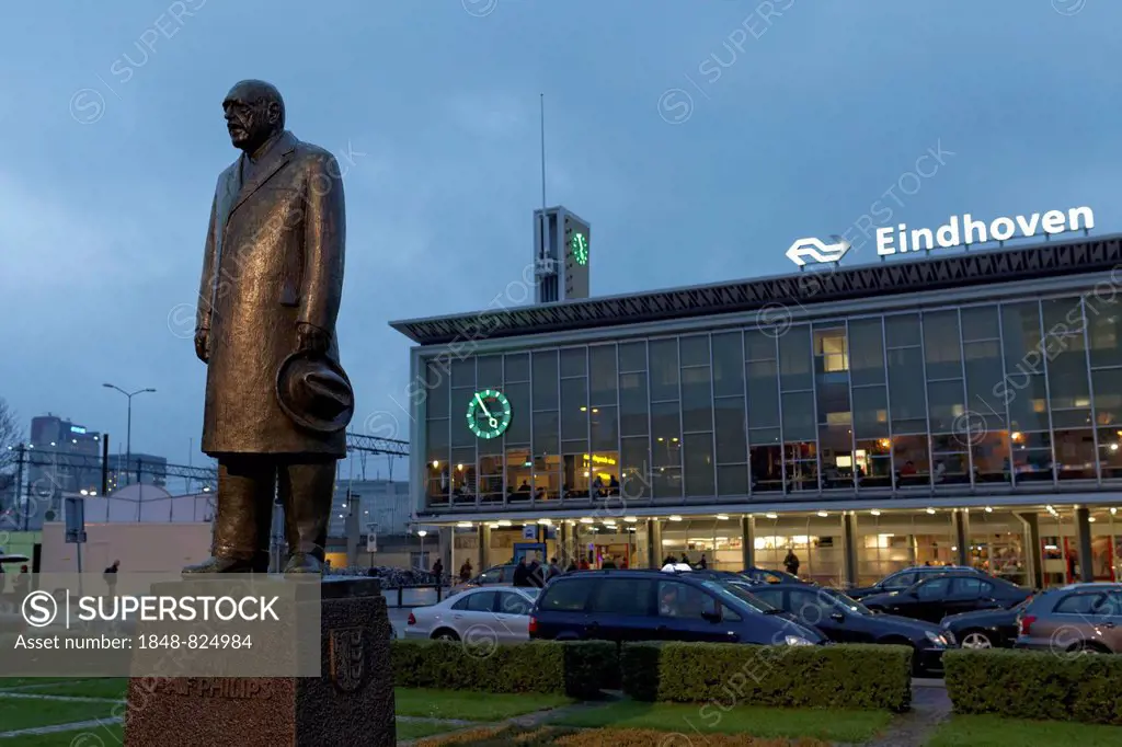 Statue of Anton Philips in front of the main railway station, at dusk, Eindhoven, North Brabant, Netherlands