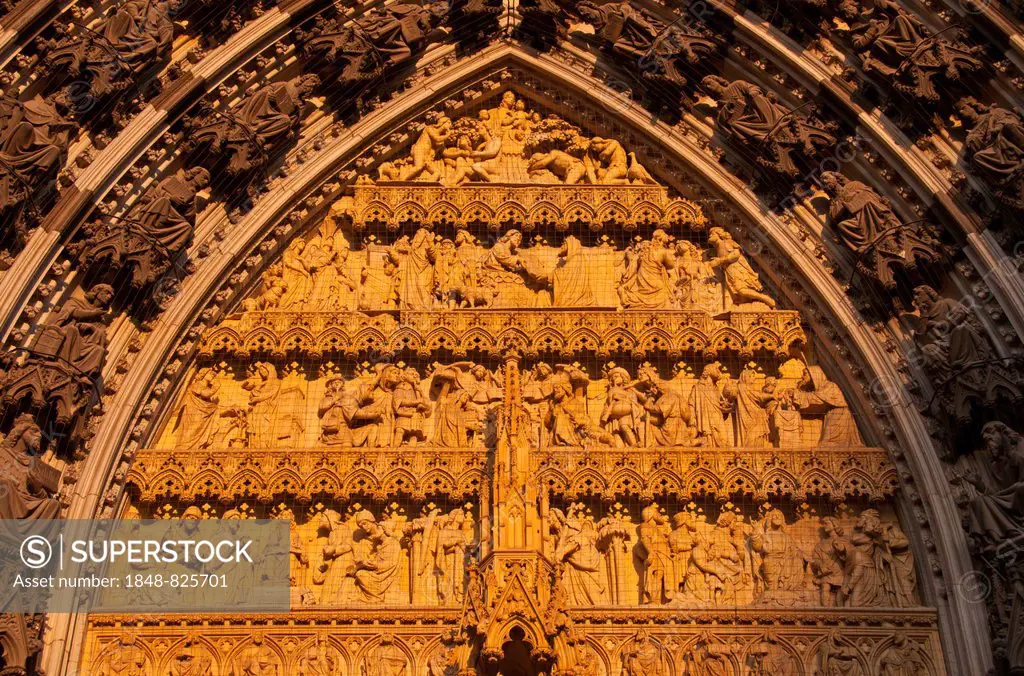 Tympanon, west portal of the west facade, with statue of Mary, baby Jesus and salvation story before to the redemption, Cologne Cathedral, Cologne, No...