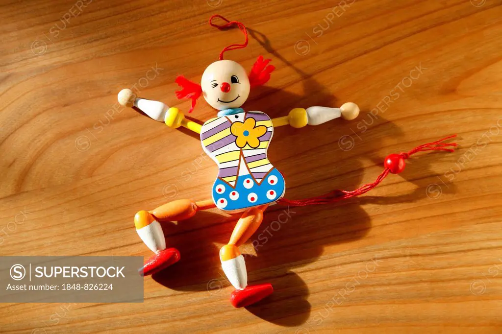 Jumping jack lying on wooden background