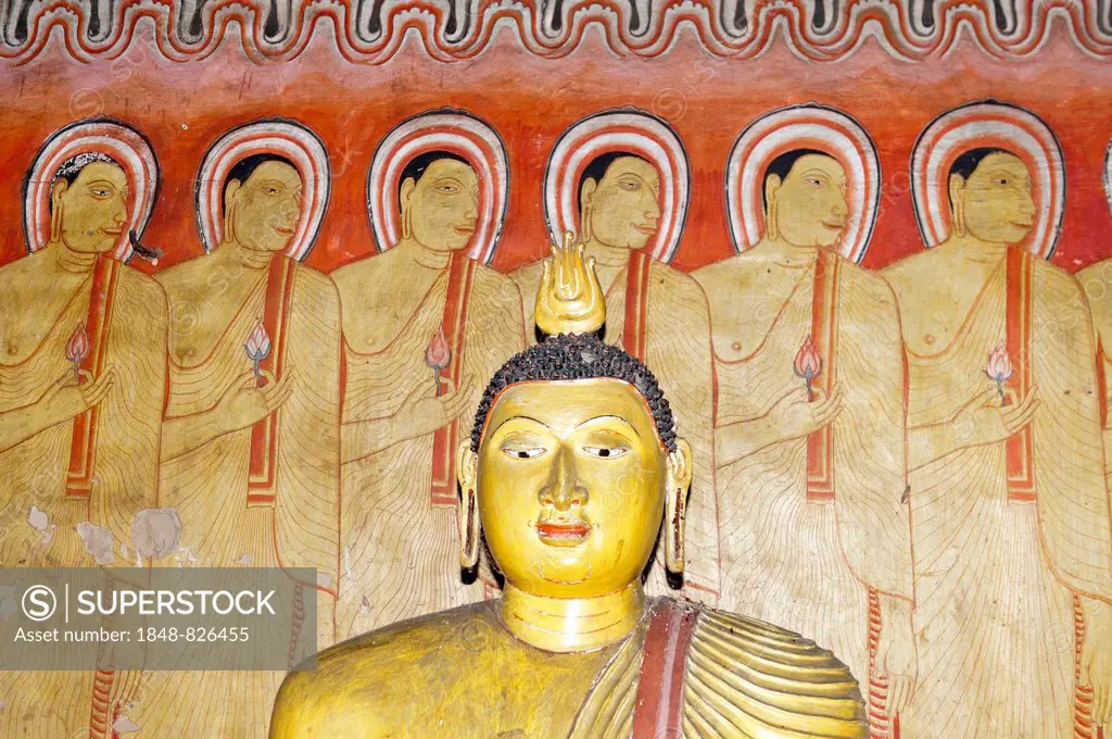 Head of a Buddha statue, colourful mural, fresco, monks standing next to each other, Maharaja-Iena cave, Buddhist cave temple of Dambulla, Golden Temp...