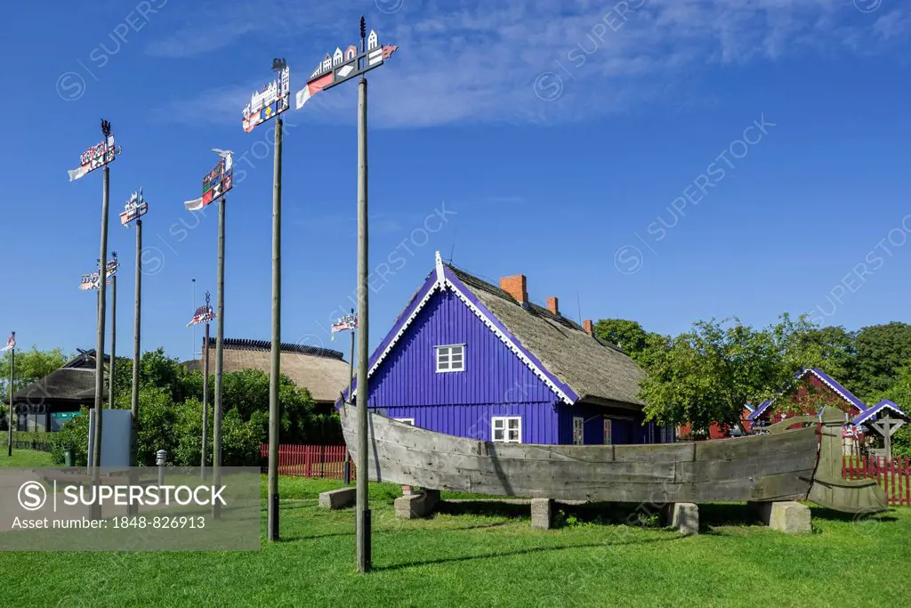 Curonian flags in front of traditional wooden houses, Nida, Klaipeda County, Lithuania