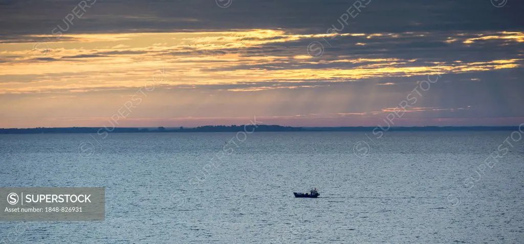 Fishing boat on the Curonian Lagoon at sunrise, Nida, Klaipeda County, Lithuania