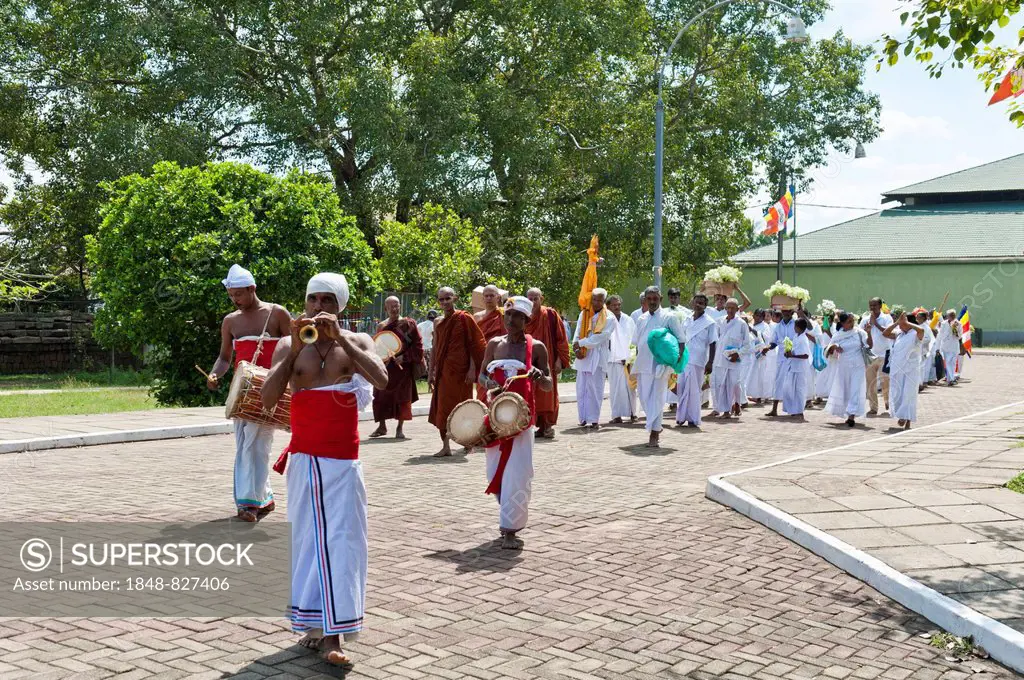 Buddhist pilgrims in a procession with music, Anuradhapura, North Central Province, Sri Lanka