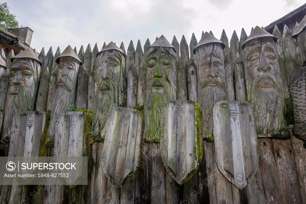 Wooden warrior figures at the entrance, Mazurski Eden or Masurian Garden of Eden, reconstruction of Galindian culture, Gmina Ruciane-Nida, Warmian-Mas...