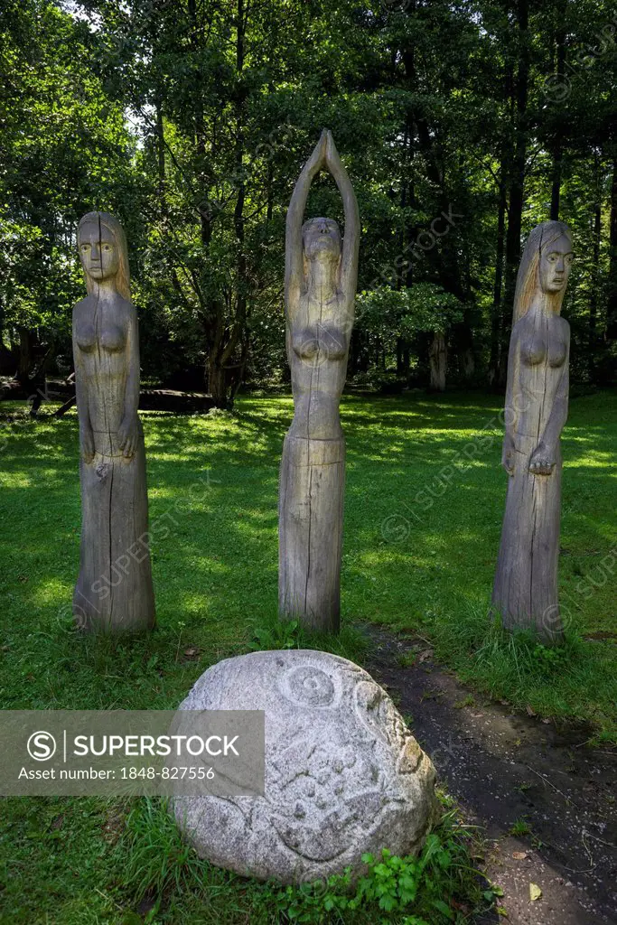 Wooden figures and a stone sculpture, Mazurski Eden or Masurian Garden of Eden, reconstruction of Galindian culture, Gmina Ruciane-Nida, Warmian-Masur...