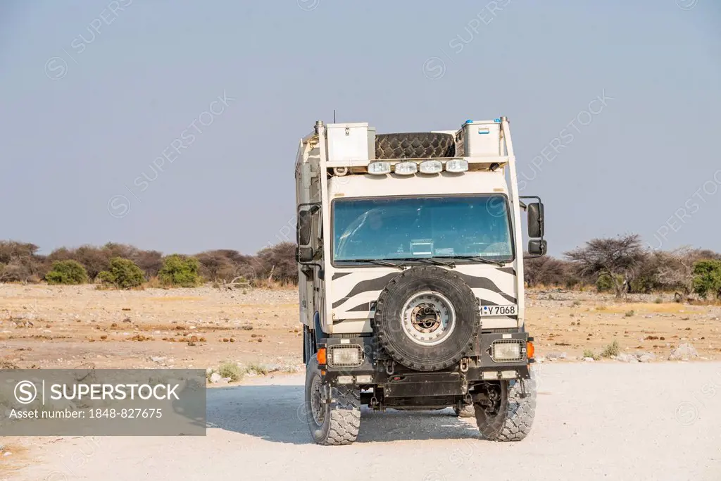 Truck with zebra stripes at the Chudop waterhole, Etosha National Park, Namibia