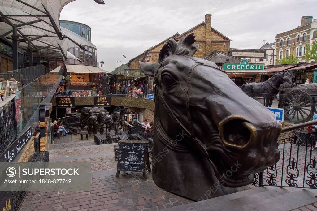 Former horse market, Stables Market, bronze sculpture of a horse's head in the foreground, London, England, United Kingdom