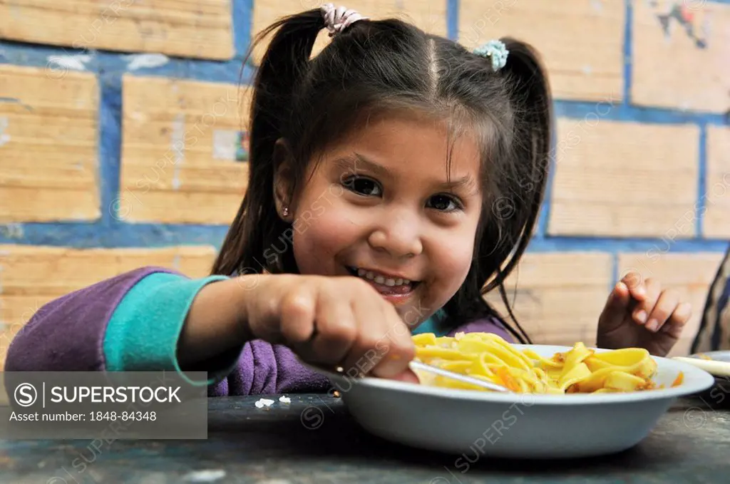 Girl having lunch, Slum Area Plan 3000, Santa Cruz, Bolivia, South America