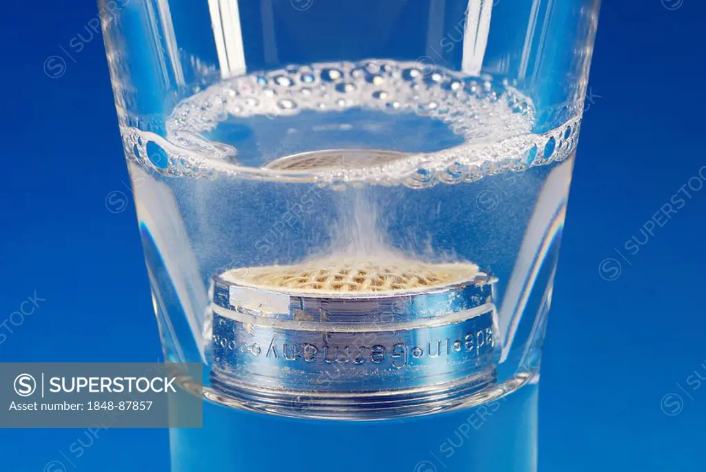 Aerator in a glass with limescale remover