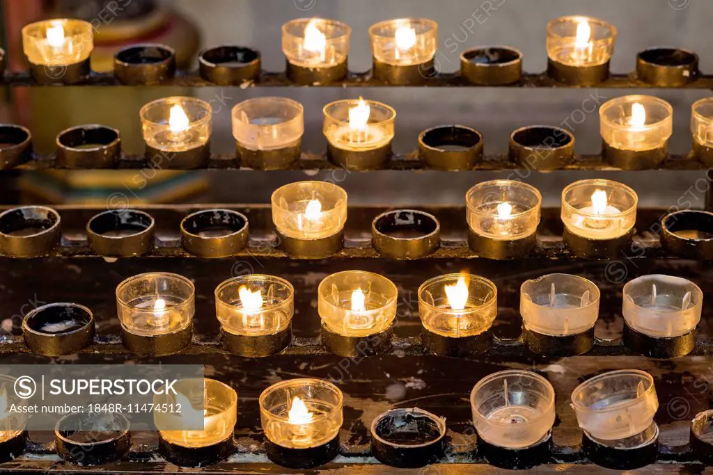 Lighted votive candles in a church, Munich, Upper Bavaria, Bavaria, Germany