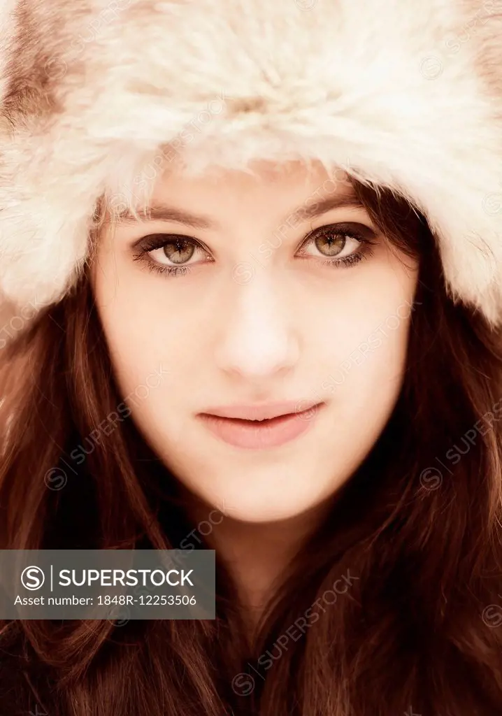 Young woman wearing a fur hat, portrait