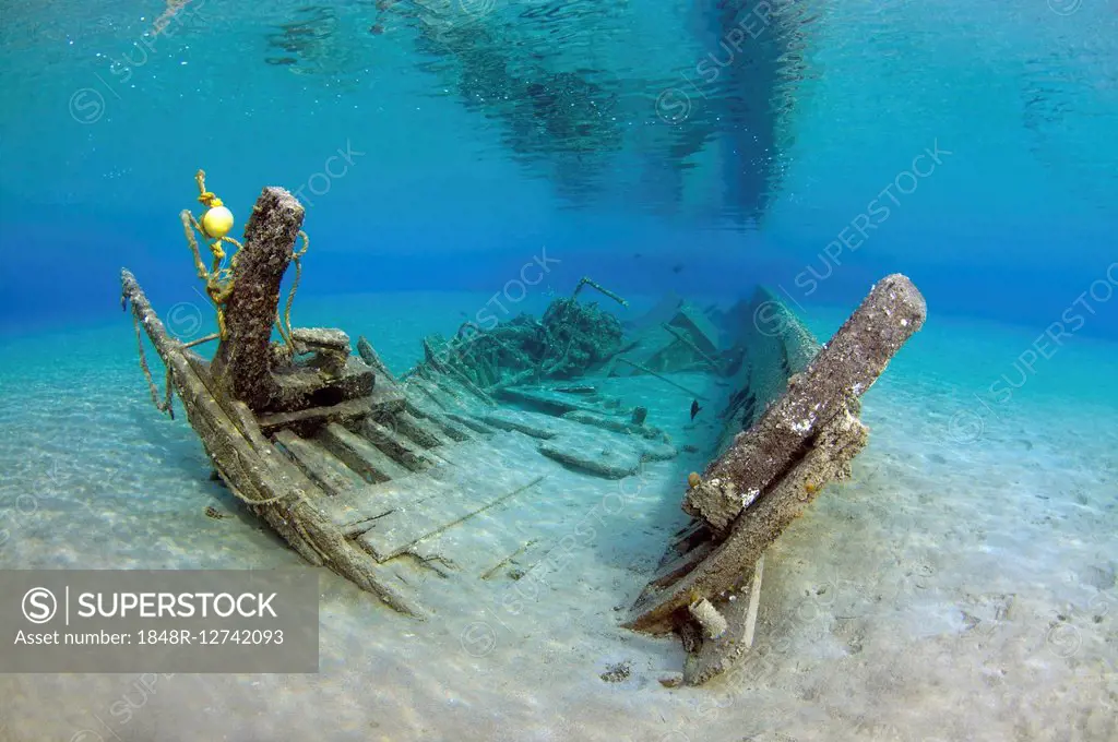 Old shipwrecked fishing boat on sandy seabed, Red Sea, Marsa Alam, Egypt
