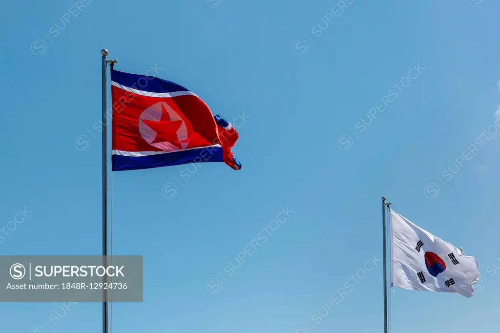 North and South Korean flags, North Korea, South Korea, flags waving in the wind, blue sky