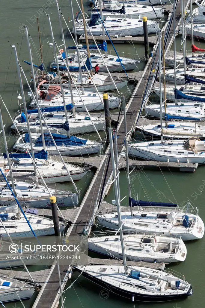 Sailing boats moored along jetty, River Tagus, Lisbon, Lisboa Region, Portugal