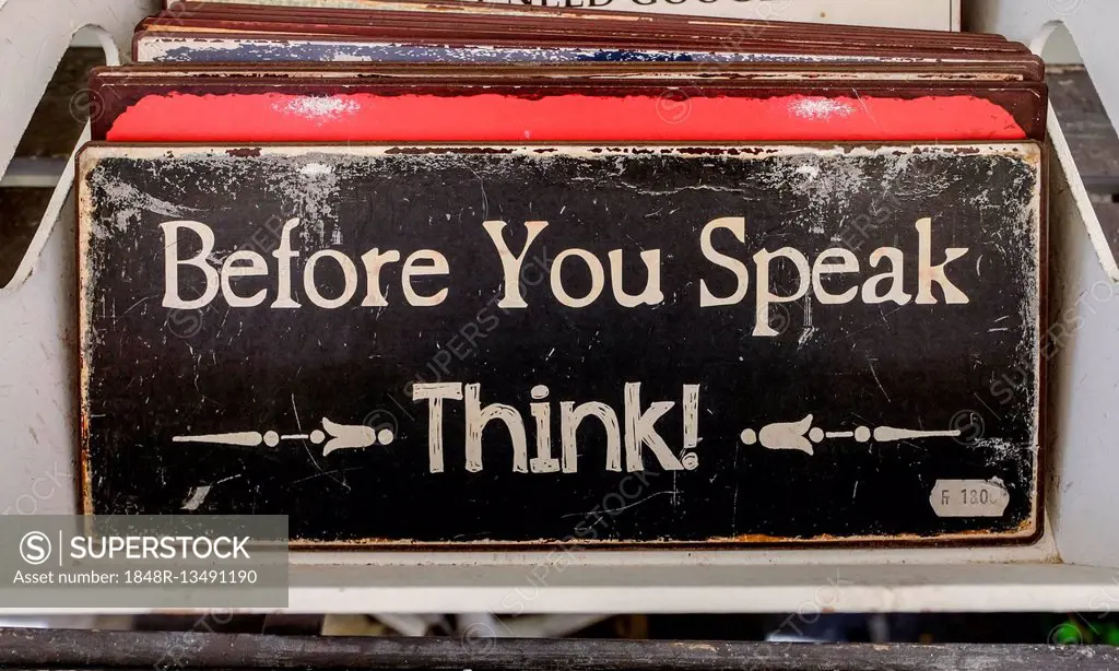 English quote on a metal sign, Before you speak, Think