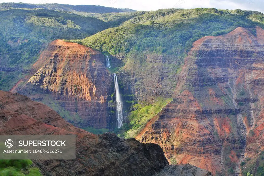 Waipo'o Falls from the steep cliffs of the Waimea Canyon, Kaua'i Island, Hawaii, USA