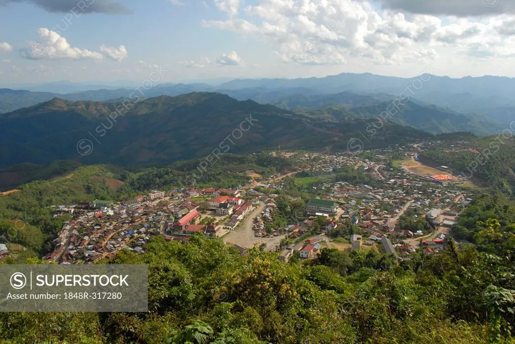 View of Phongsali City on a slope in a forested mountain landscape, Phongsali City, Laos, Asia