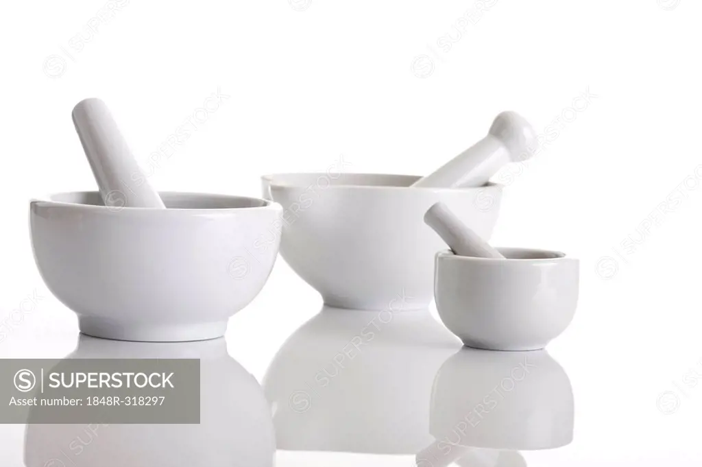 Three white porcelain mortar and pestle of different sizes