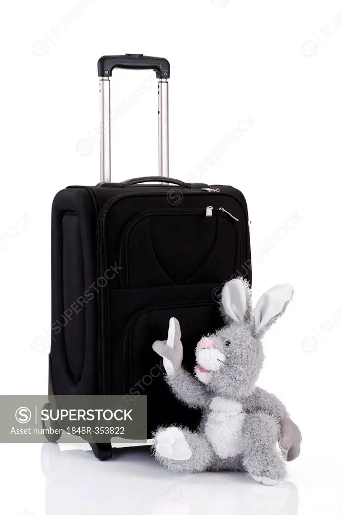 Easter bunny soft toy pointing to the trolley, Easter holiday