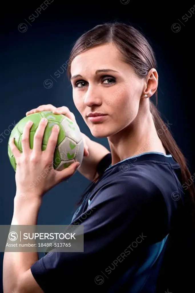 Female handball player with ball