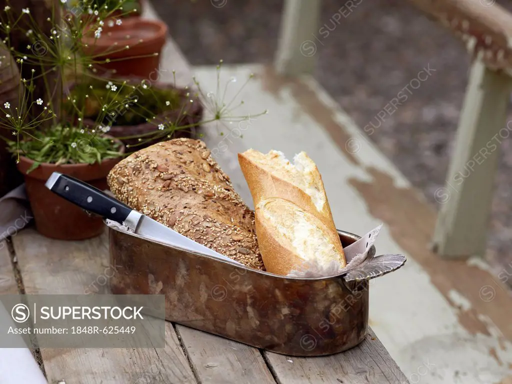 Still life, antique bread basket on an old wooden table