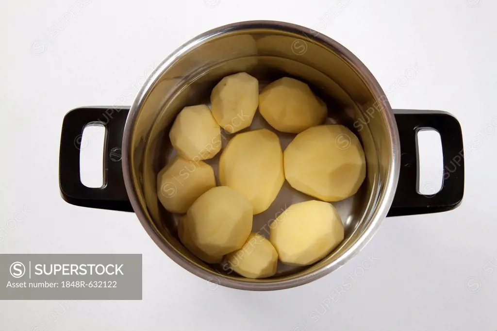 Pot with peeled potatoes