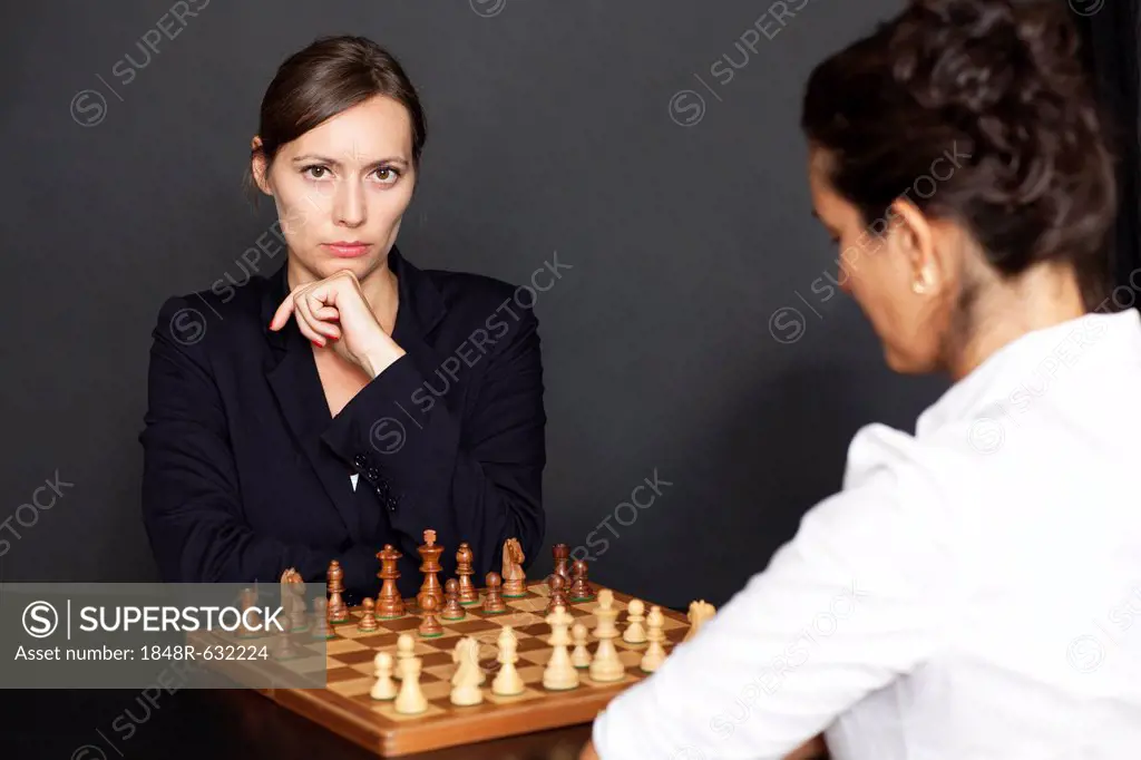 Two women playing chess