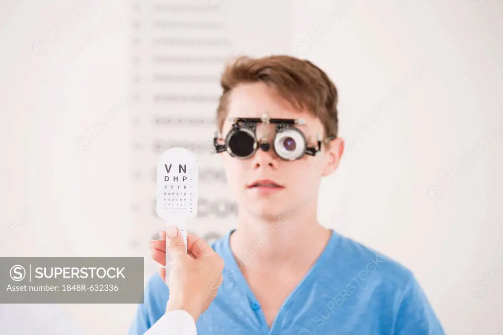 Teenager boy during a vision test at the ophthalmologist