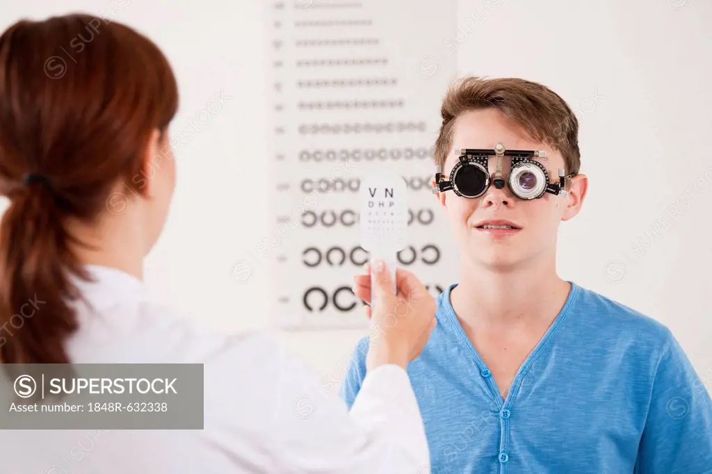 Teenager boy during a vision test at the ophthalmologist
