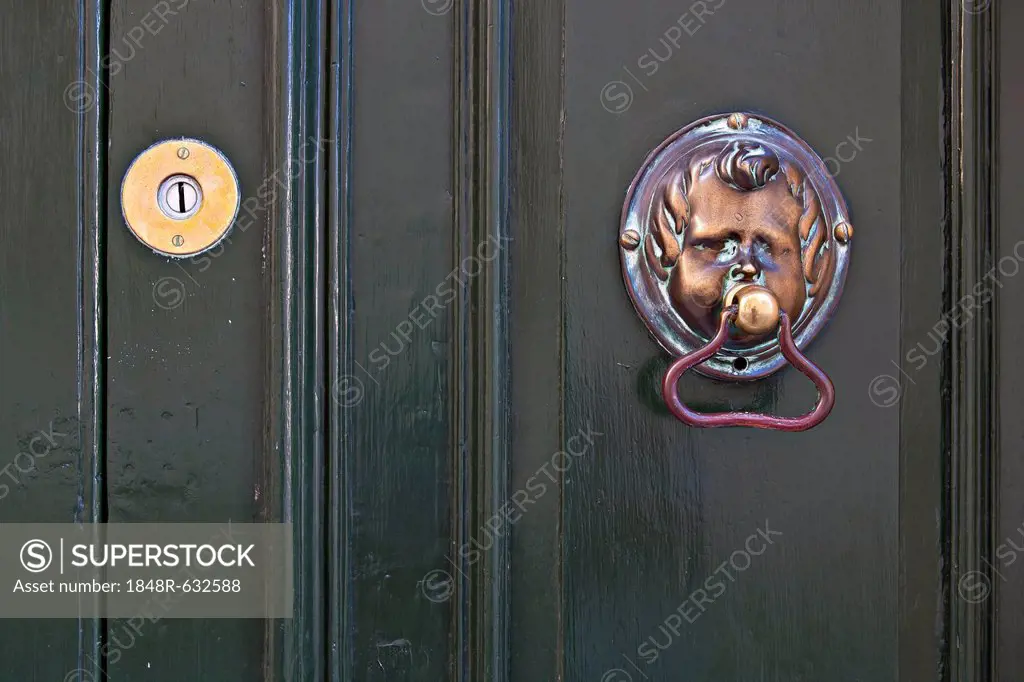 Door knocker shaped like a face on front door, Valletta, Malta, Europe