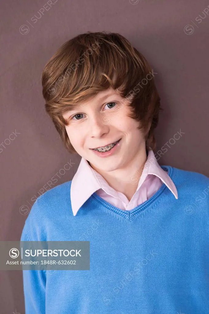 Smiling boy with braces, portrait