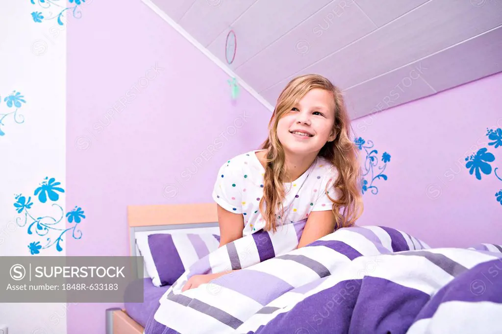 Girl, 11, lying in bed