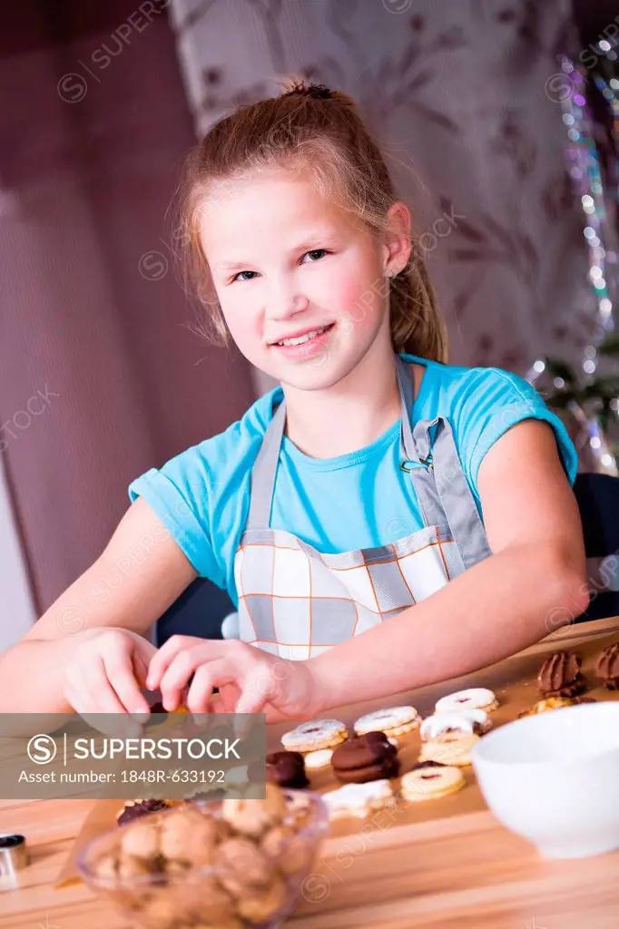 Girl baking Christmas cookies