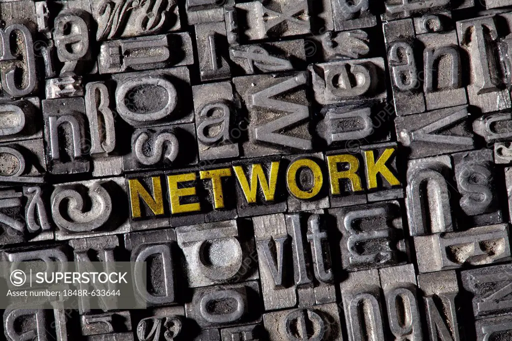 Old lead letters spelling the word NETWORK