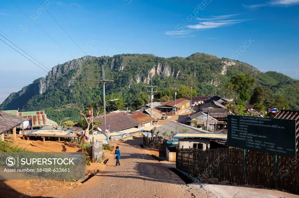 Houses roofed with corrugated iron, road, village of the Akha hill tribe, Santikhiri or Mae Salong area, Chiang Rai province, northern Thailand, Thail...