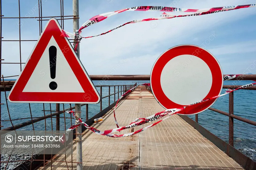 Warning sign and no access sign on an old loading pier, Isola Eole, Sicily, Italy, Europe