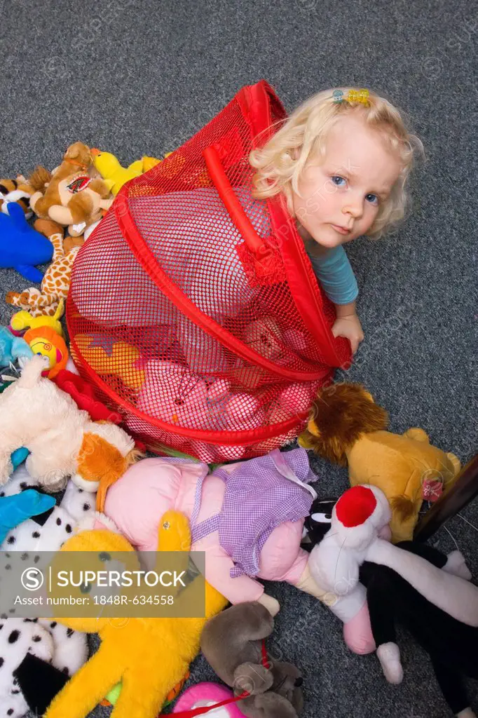 Little girl, 3 years, with toys
