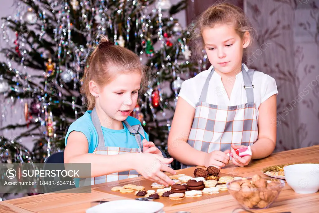 Girls baking Christmas cookies