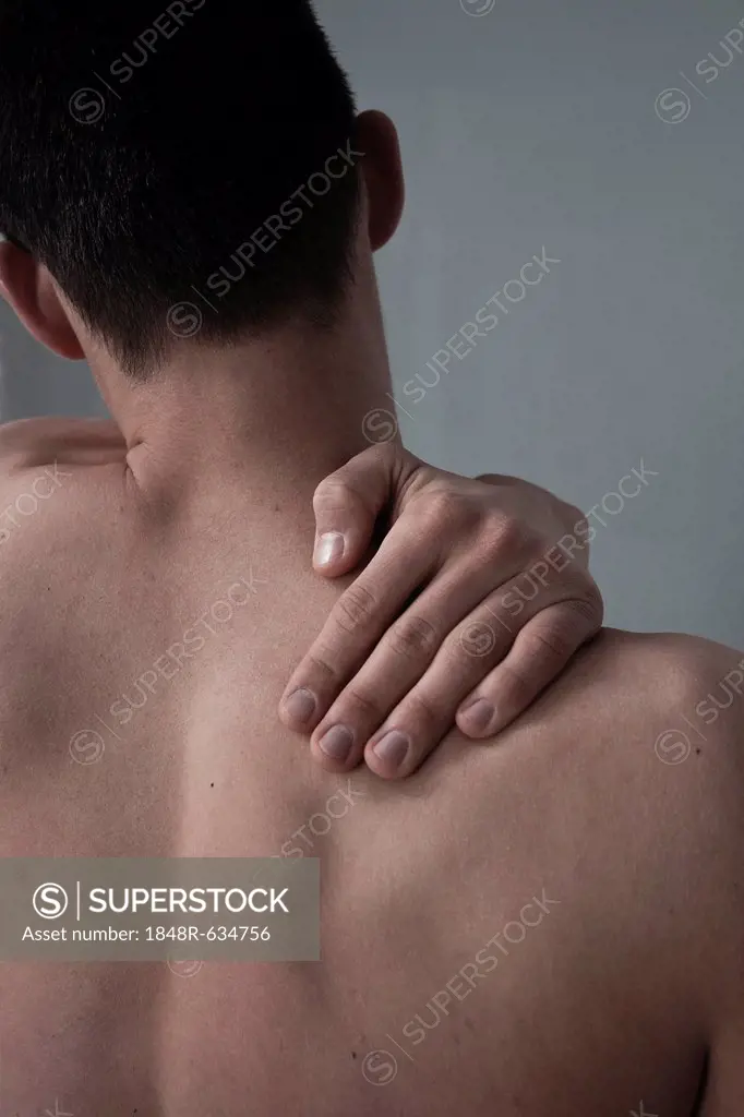 Young man with back pain, neck pain