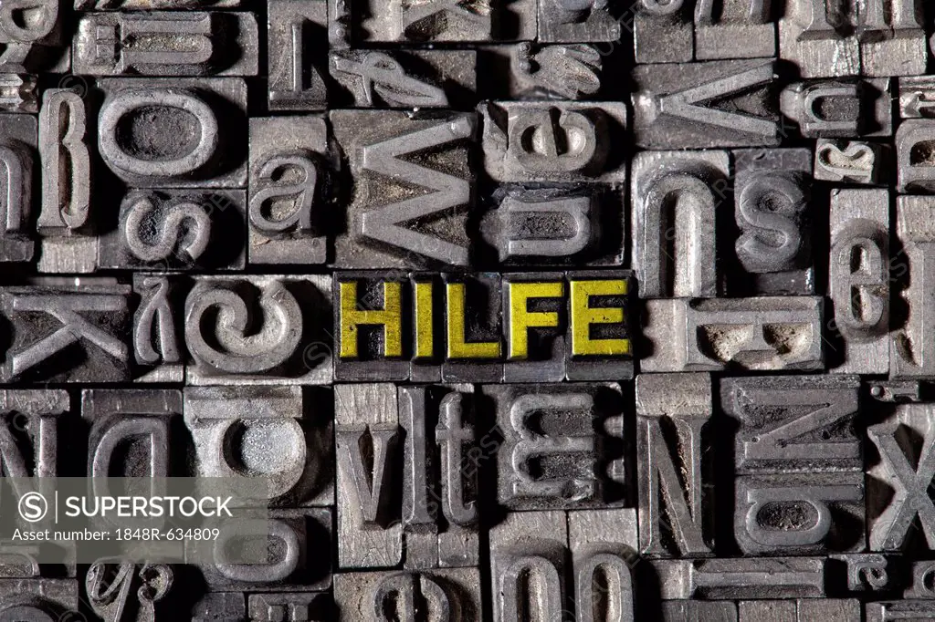 The word Hilfe, German for help, made of old lead type