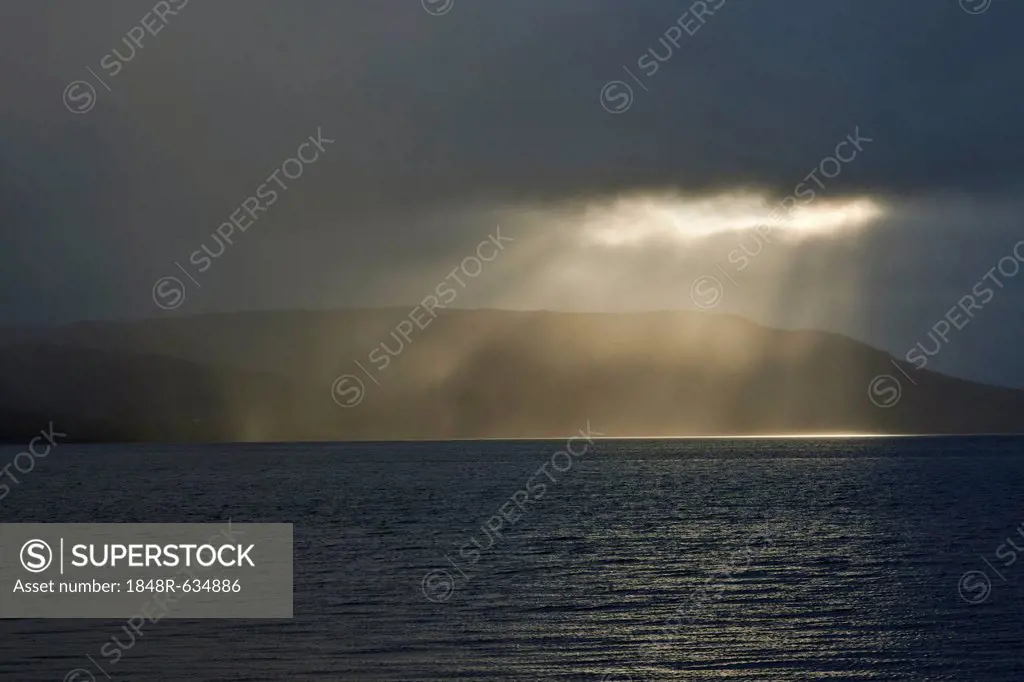 Gap in the clouds with sun shining through, Patreksfjoerdur Fjord, Westfjords or West Fjords, Iceland, Europe
