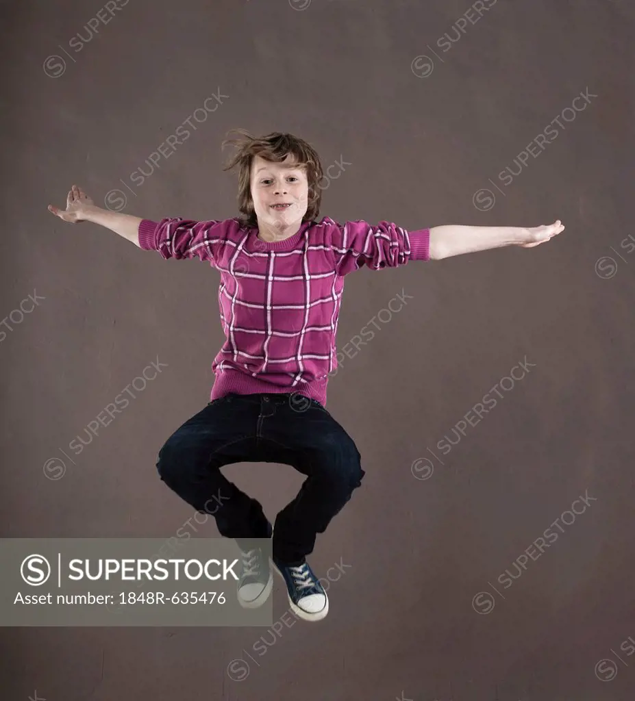 Boy leaping into the air