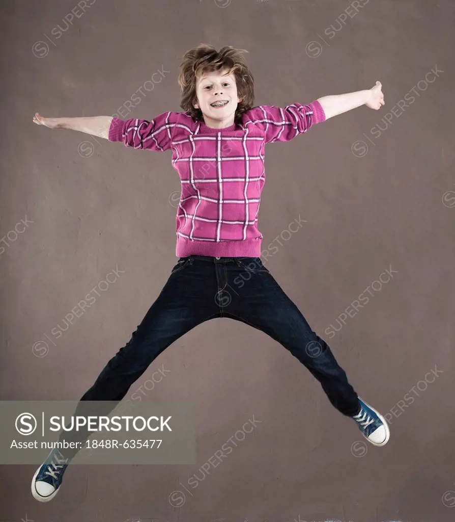 Boy leaping into the air