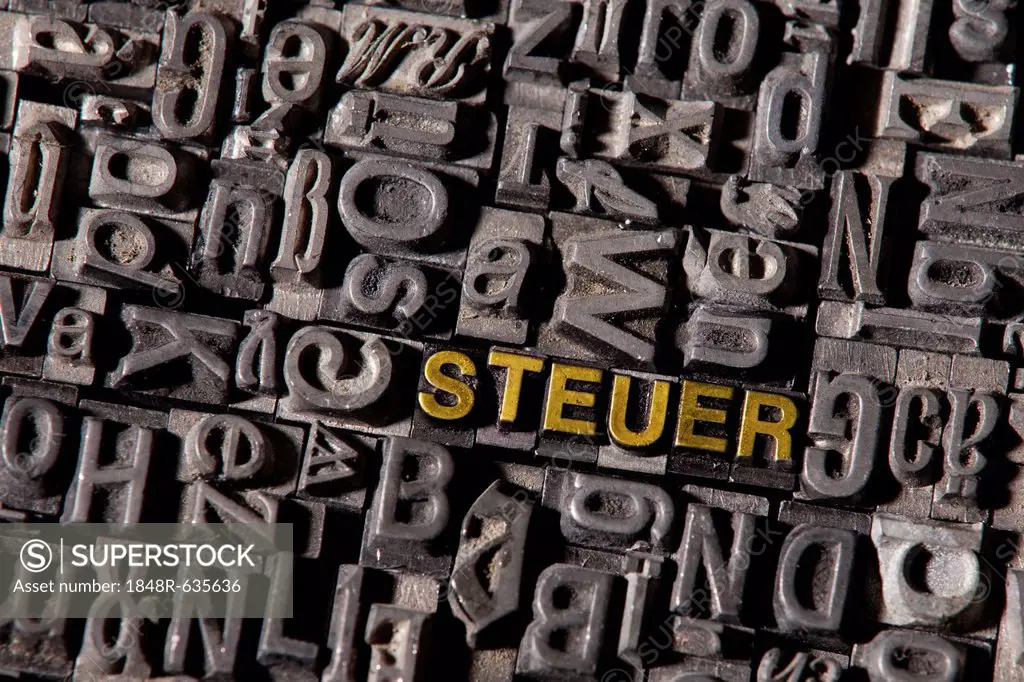 The word Steuer, German for tax, made of old lead type