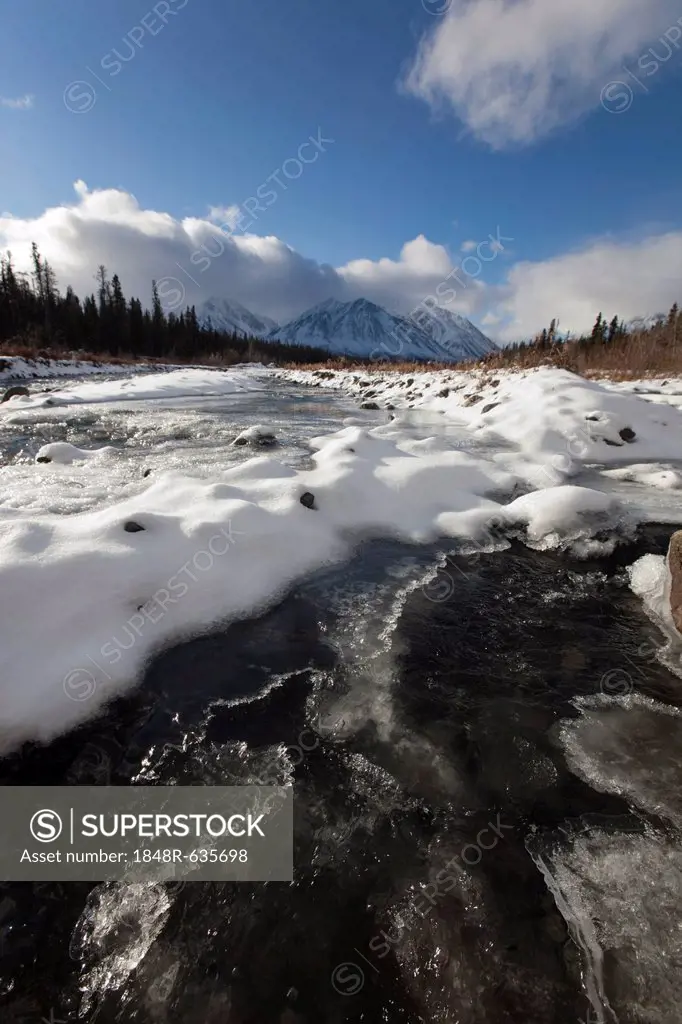 Ice, snow and water at freezing Quill Creek, St. Elias Mountains, Kluane Range behind, Kluane National Park and Reserve, Yukon Territory, Canada