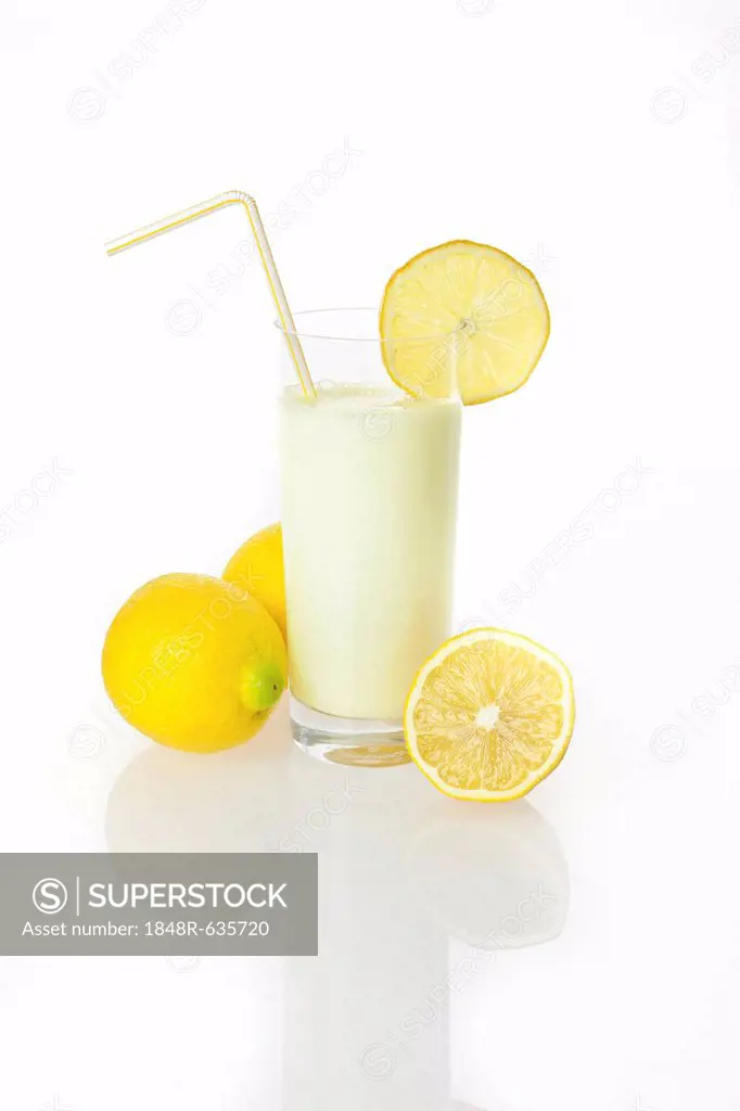 Lemon drinking yoghurt, lemon shake in a glass and lemons
