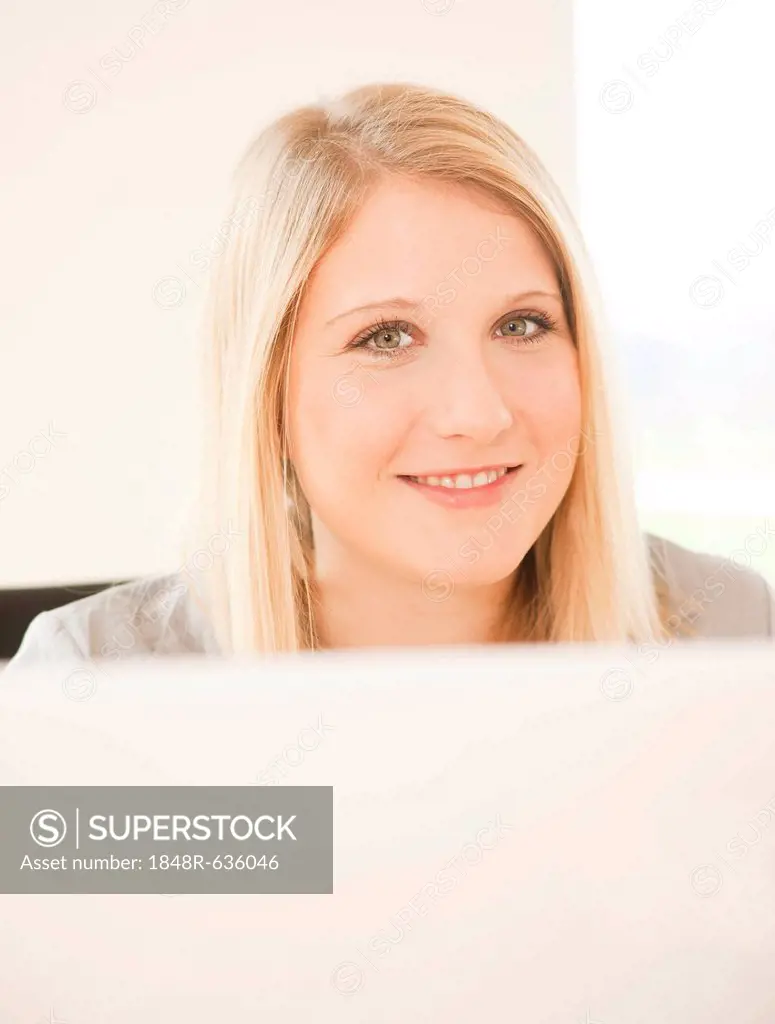 Young woman in front of computer screen