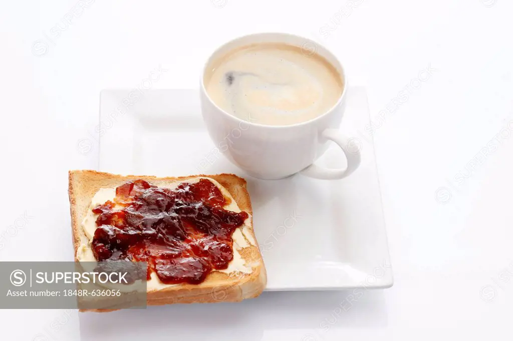 Porcelain plate with a cup of coffee and toast with strawberry jam