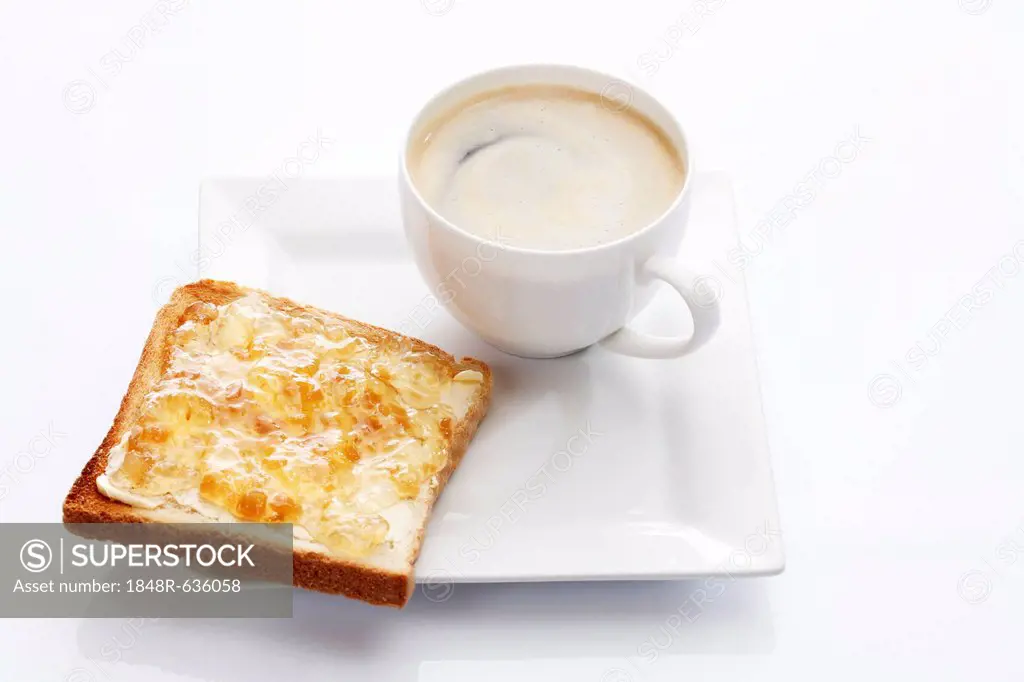 Porcelain plate with a cup of coffee and toast with ginger marmalade