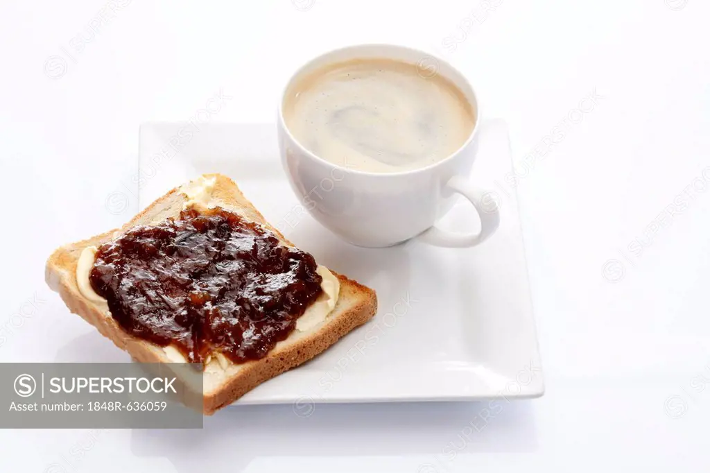 Porcelain plate with a cup of coffee and toast with rhubarb jam